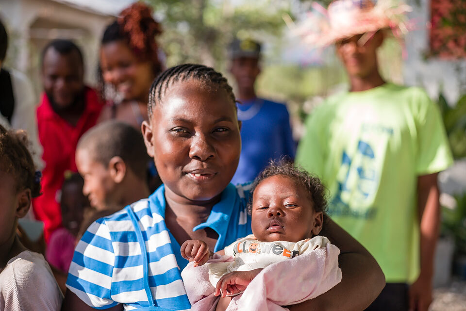 woman-holding-baby-haiti